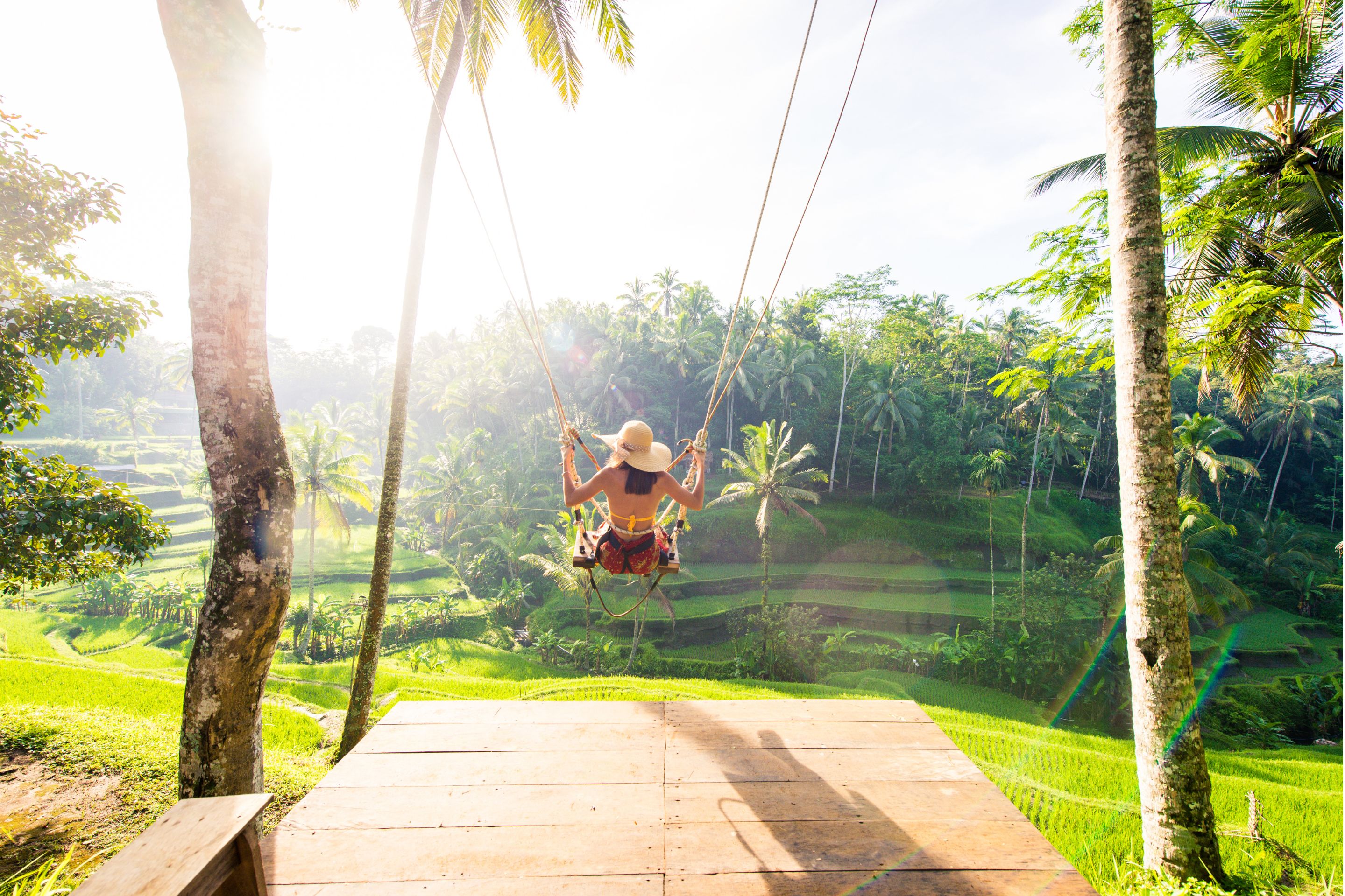 Woman swings on Bali swing