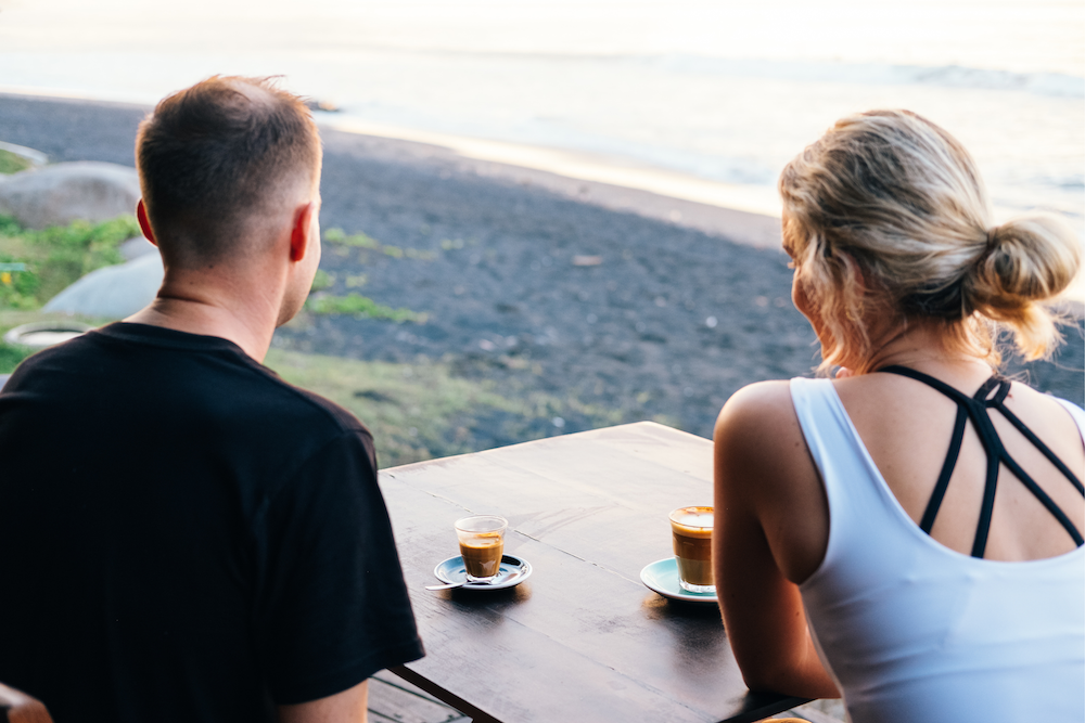 Two people enjoying a coffee on their wellness retreat in Bali