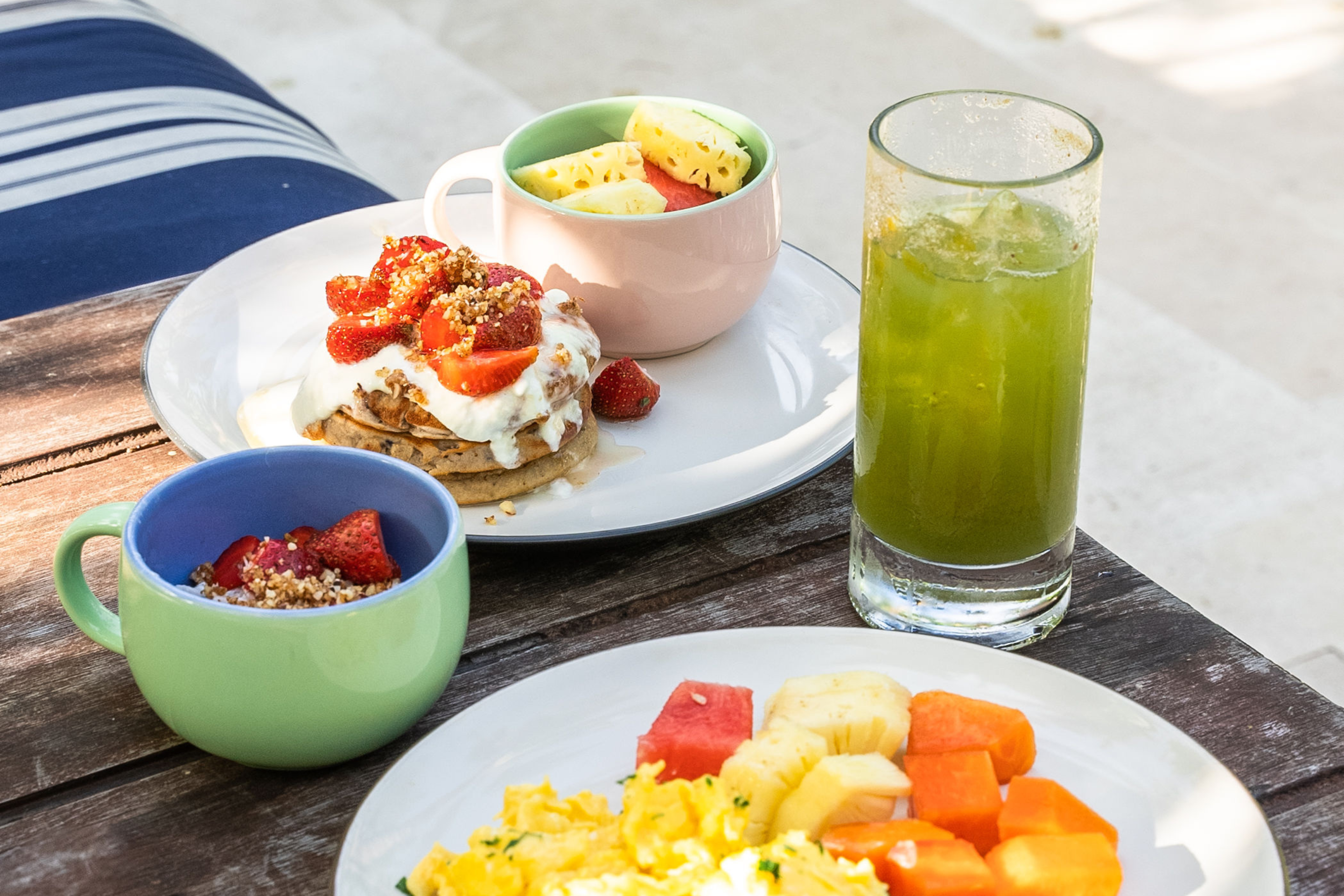 breakfast foods and juice served at Hotel Komune
