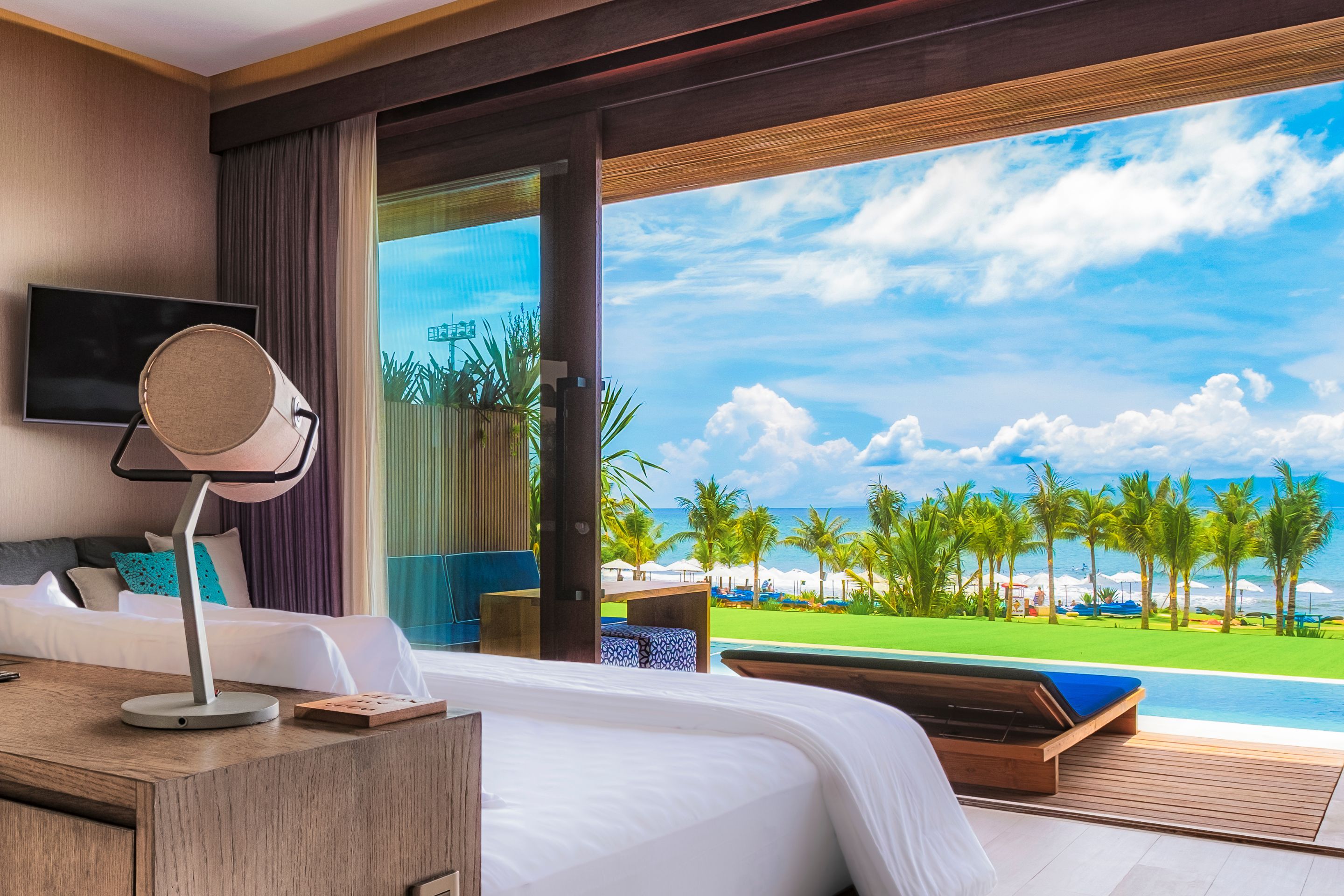 Beachfront pool suites overlooking Hotel Komune resort & Keramas surf break
