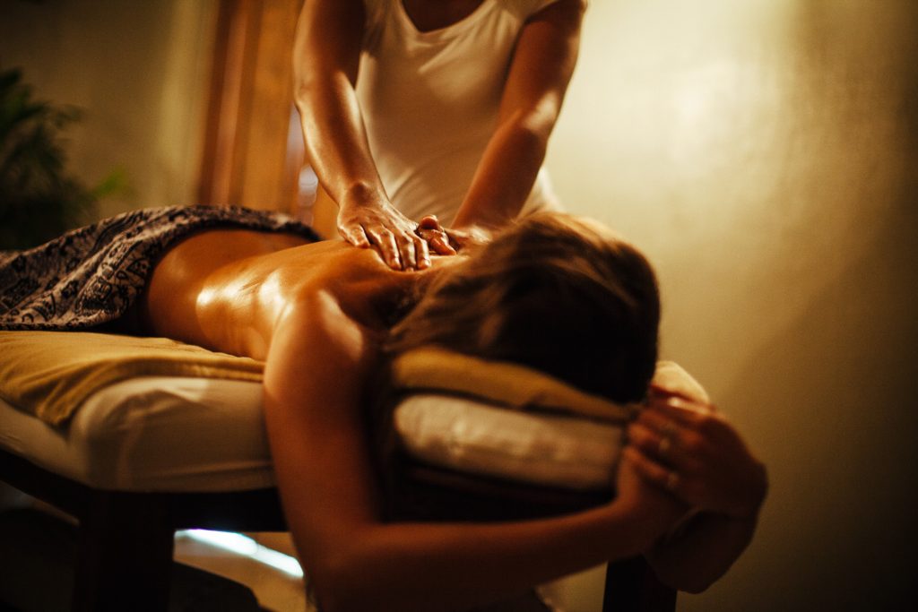 woman having relaxing massage at Hotel Komune day spa