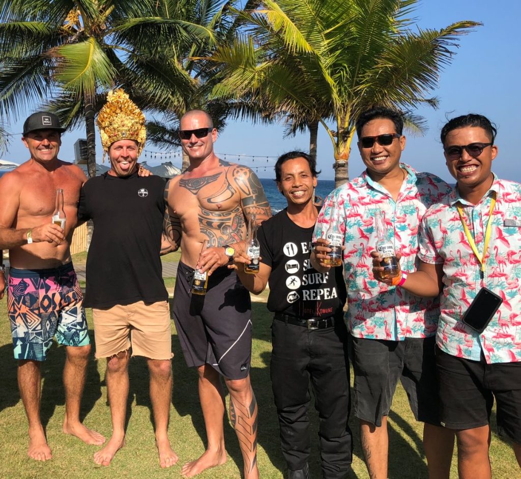 Tony Cannon with beach club team members Big Chef Suangga, Agus and Dewa on the lawn in front of the Keramas surf break
