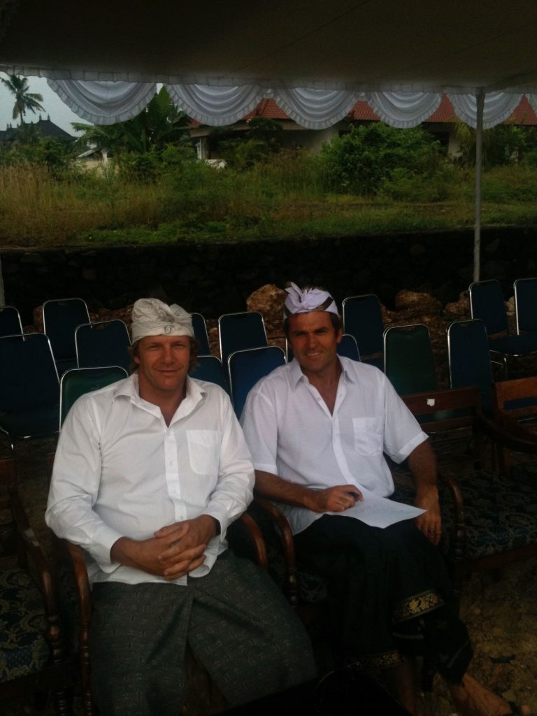 Tony Cannon and Luke Egan in traditional Balinese white ceremonial dress at the Hotel Komune ground breaking ceremony, 2010