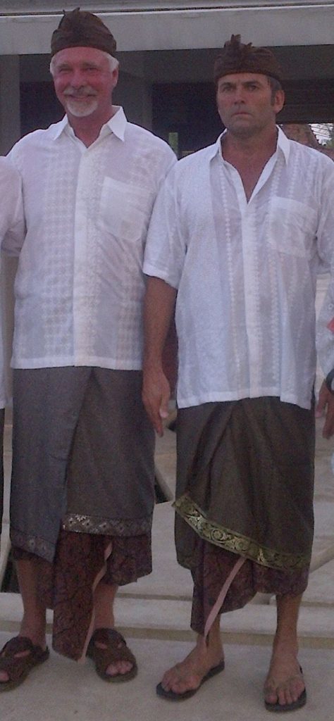 Hotel Komune co-founders Tony de Leede and Tony Cannon in traditional Balinese ceremonial dress at a Komune blessing ceremony